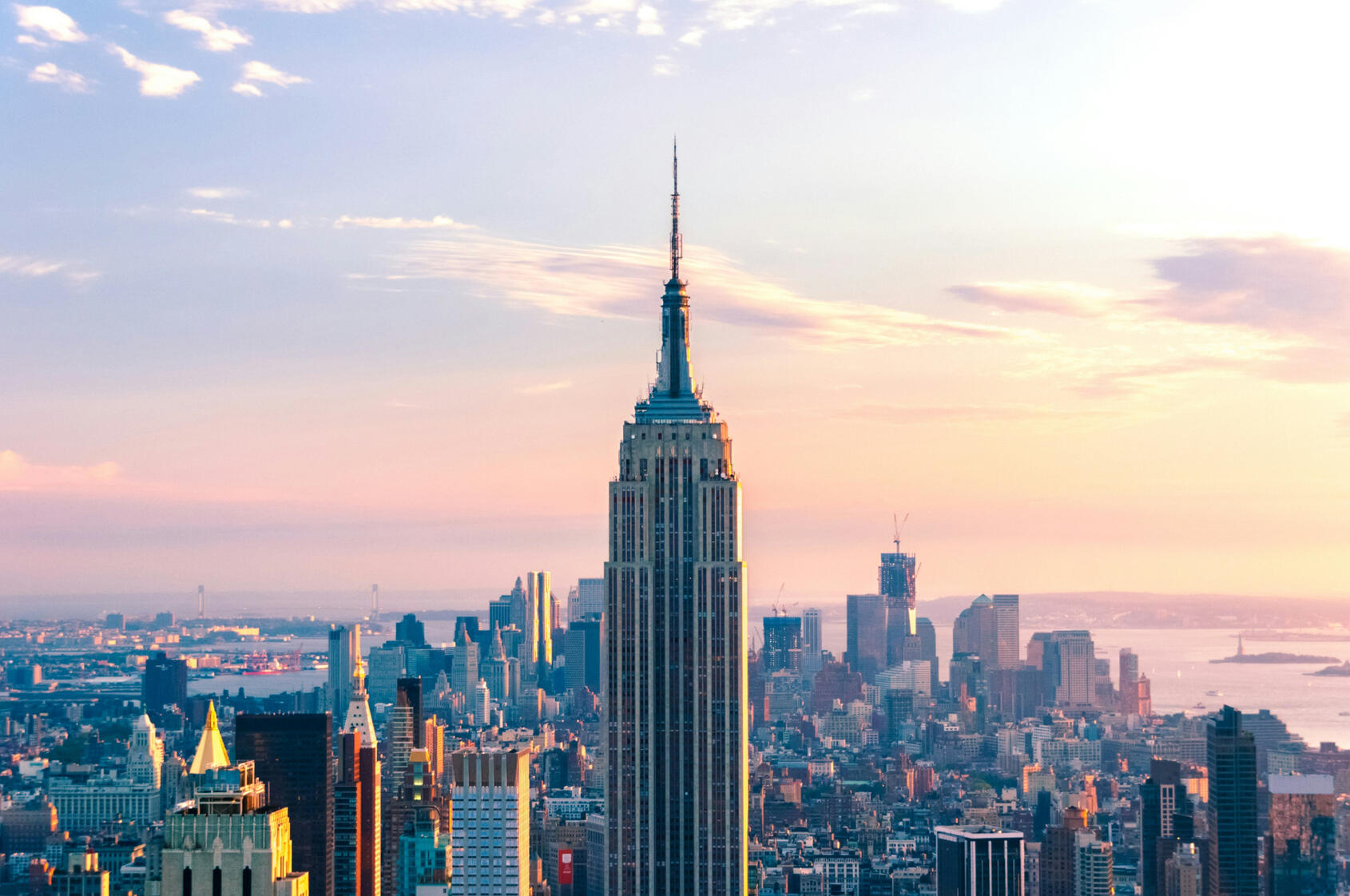 New York City Skyline at dusk Empire State Building in the foreground of a New York City Skyline at dusk. Background shows other skyscrapers building the iconic New York skyline